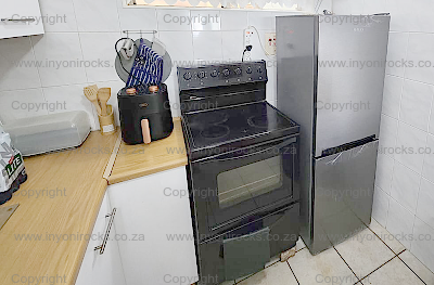 Photo showing the new airfryer and fridge with bottom freezer.